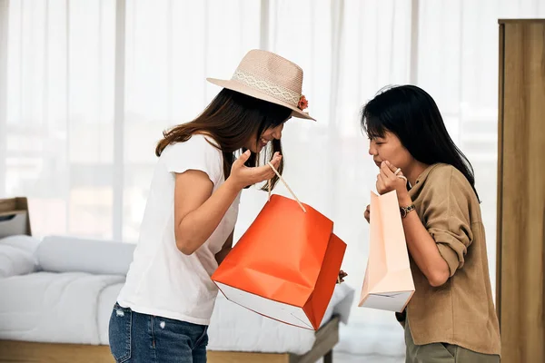 Two Asian Young Women Holding Shopping Paper Bag Looking Talking — Stock Photo, Image