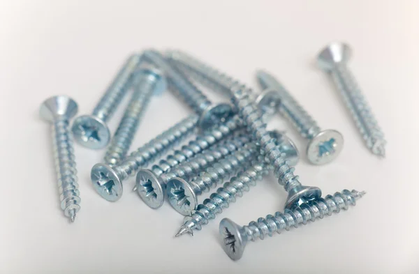 Screws over white background — Stock Photo, Image