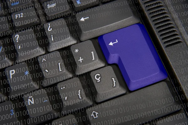 Black keyboard with blue key — Stock Photo, Image