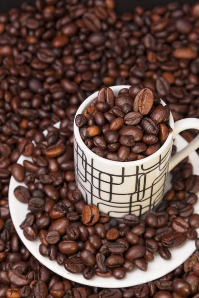 Copo e grãos de café — Fotografia de Stock