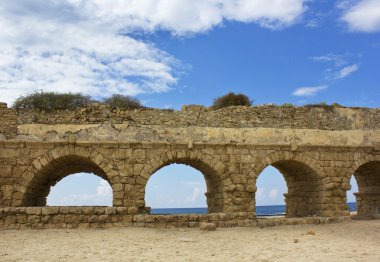 Stone arches of ancient Roman aqueduct clipart