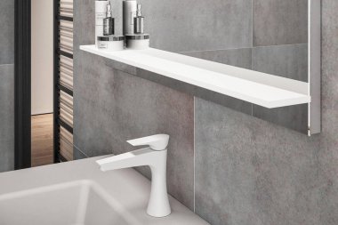 Lavabo ve musluk banyoda, en az stil.