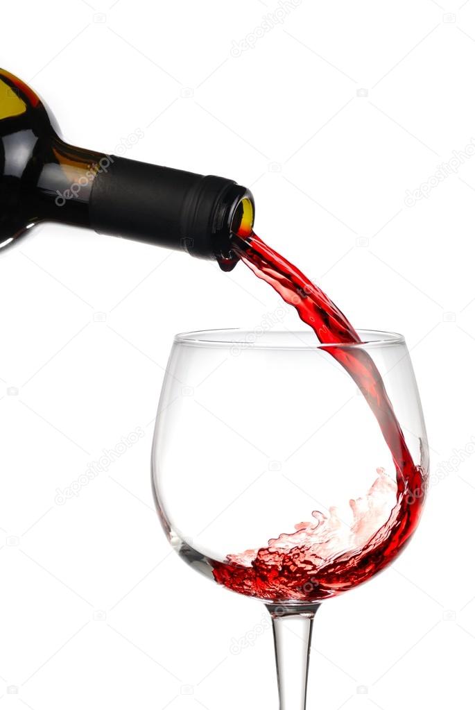 Pouring red wine into a wineglass