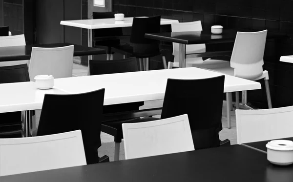 Street small cafe with bw tables and chairs. — Stock Photo, Image