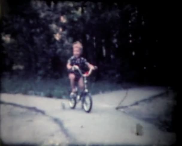 Boy on bike, vintage 8mm film footage. — Stock Video