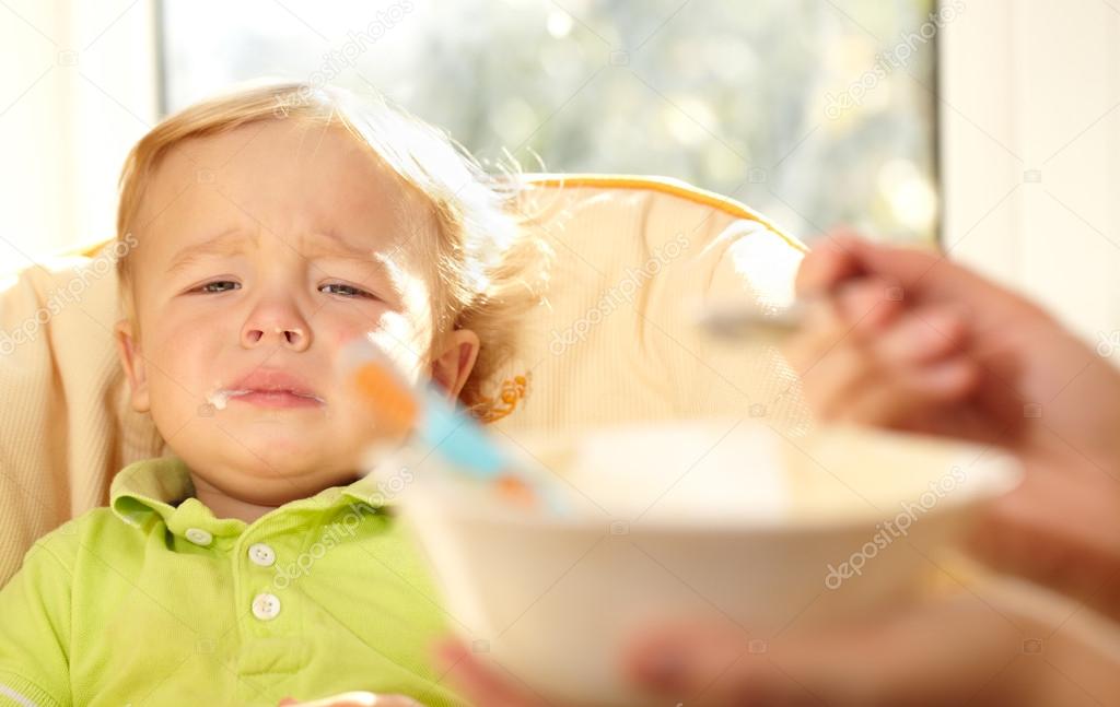 Kid is very disappointmented about porridge.