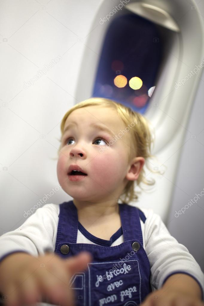 Young passenger in the plane.