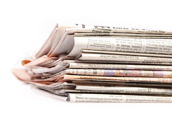 International newspapers on white. — Stock Photo, Image