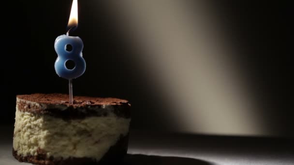 Candle eight in tiramisu cake. Birthday vintage background — Stock Video