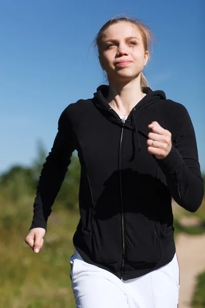 Girl running in the park. Close up — Stock Photo, Image