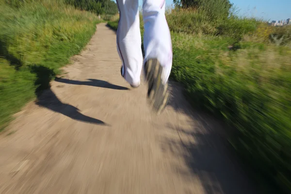 Running in the park. Detail of legs — Stock Photo, Image