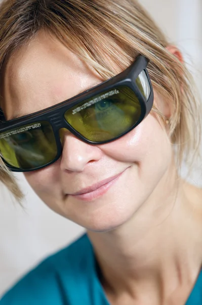 Smiling therapist in protective goggles — Stock Photo, Image