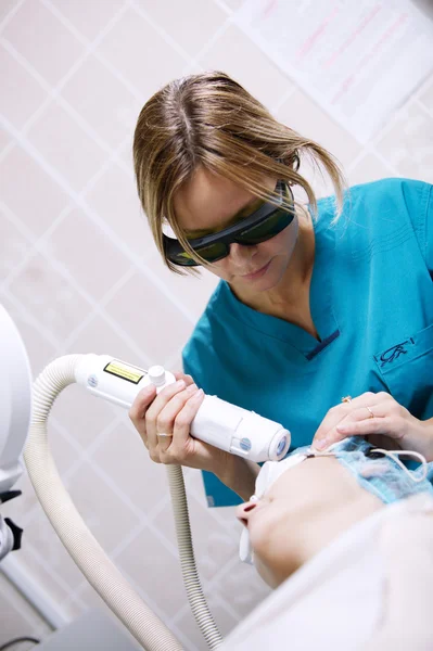 Patient undergoing skin treatment with a laser — Stock Photo, Image