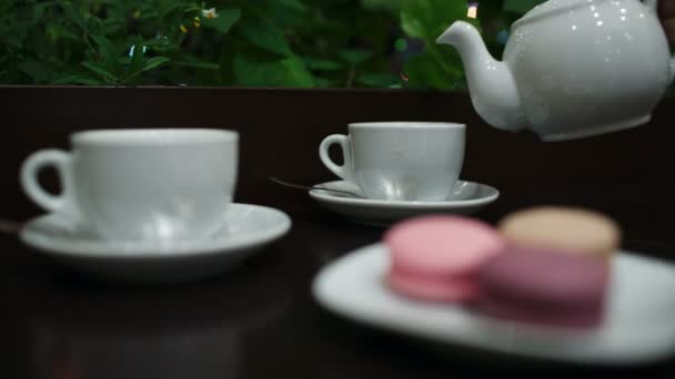 Tea with macaroons in cafe. — Stock Video