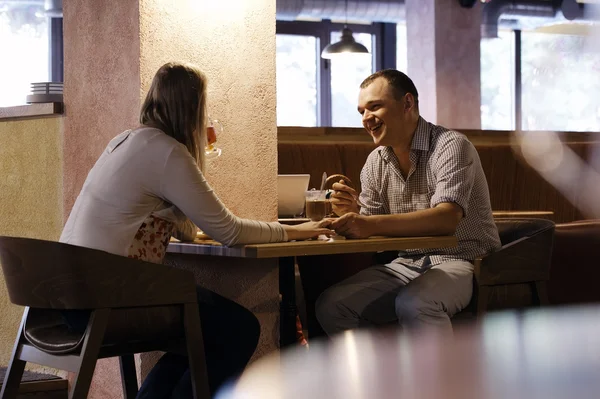 Young couple in a cafe — Stock Photo, Image