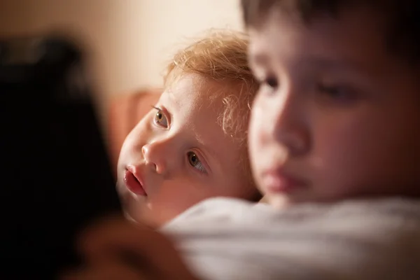 Cute young child relaxing with his brother — Stock Photo, Image