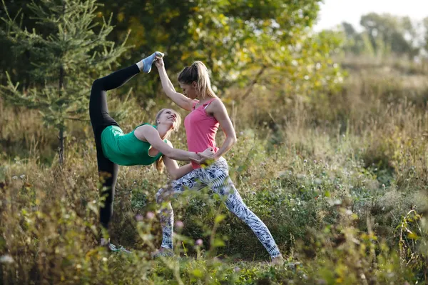 Two beautiful gymnasts or dancers working out — Stock Photo, Image