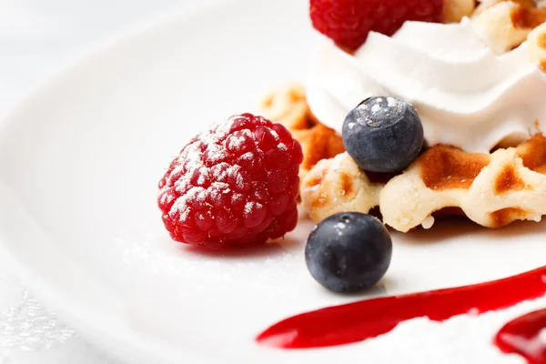 Golden waffle served with cream and berries — Stock Photo, Image