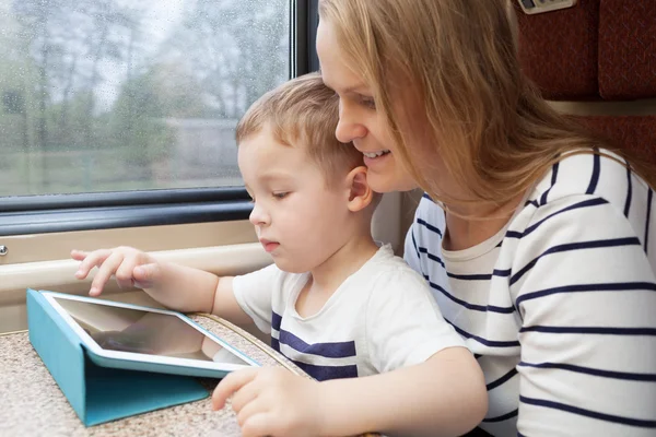 Mother and her young son on a train — Stock Photo, Image