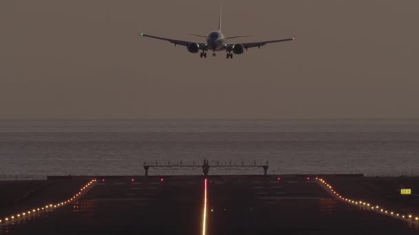 Frontal View Aircraft Descends Lands Runway Illuminated Landing Lights Starting — Stock Video