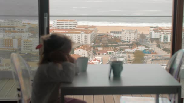 Little Girl Pajamas Watching Cartoons Smartphone While Waiting Breakfast Balcony — Stock Video