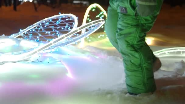 Close Children Legs Green Overalls Warm Boots Walking Snow Glowing — Stok video