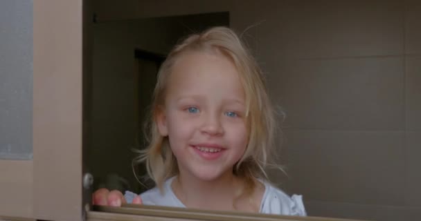 Close Shot Happy Little Girl Popped Open House Window Smiling — Stockvideo