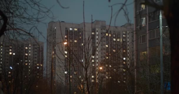 Housing Area Dusk High Apartment Blocks Lights Windows Bare Trees — Stock Video