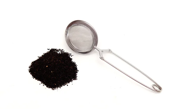 Szczypce, herbaty i czarnej — Zdjęcie stockowe