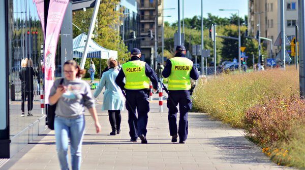 Warsaw, Poland. 4 Oktober 2021. Polish policewoman in a yellow reflective vest on duty.