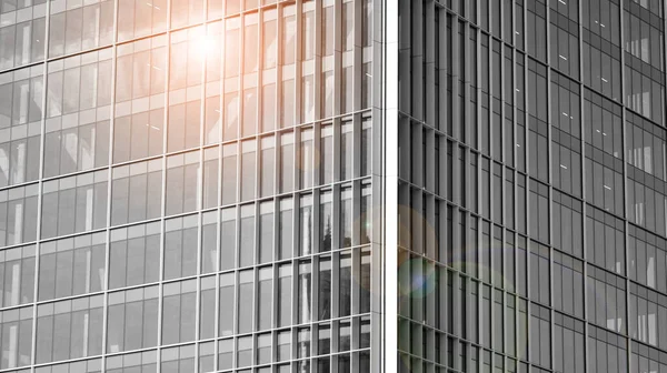 Corporate architecture building. New modern office building. Textured blue pane of contemporary glass architectural building. Black and white.