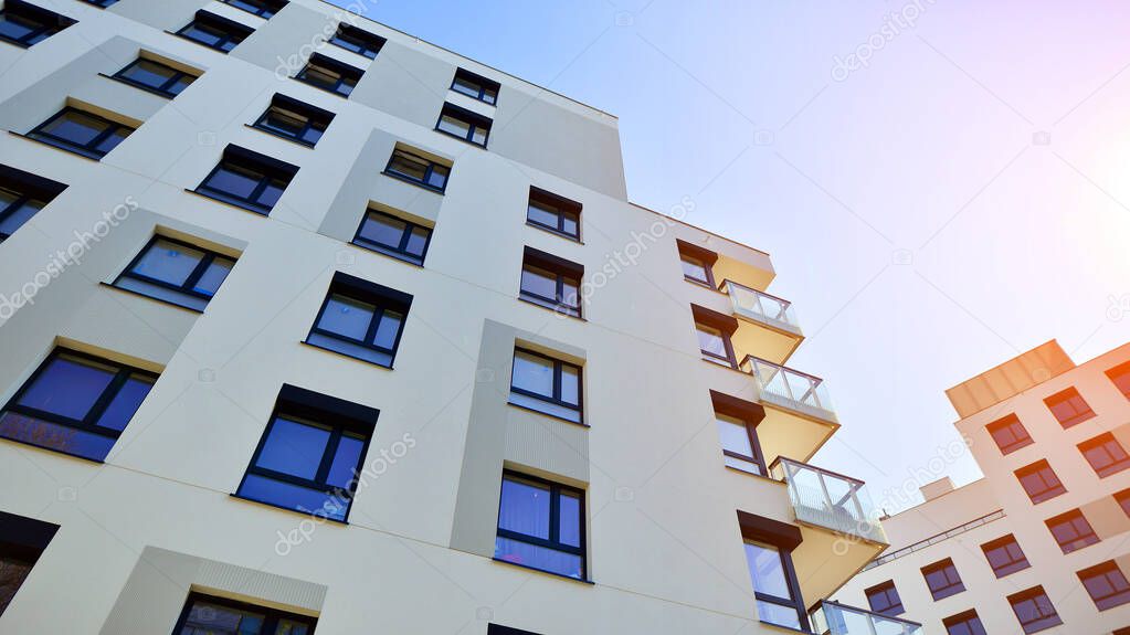 Modern residential apartment house  architecture in europe. Innovative and resident-friendly architectural solutions.  Blue sky on the background. With sunlight.