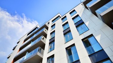 Modern luxury residential flat. Modern apartment building on a sunny day. Apartment building with a blue sky. Facade of a modern apartment building.