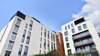  Modern luxury residential flat. Modern apartment building on a sunny day. Apartment building with a blue sky. Facade of a modern apartment building.