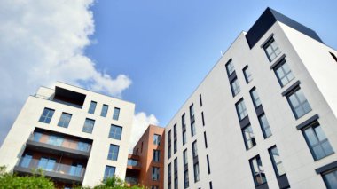  Modern luxury residential flat. Modern apartment building on a sunny day. Apartment building with a blue sky. Facade of a modern apartment building.
