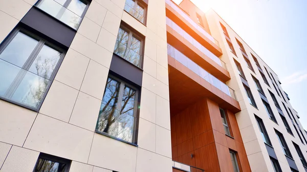  Modern luxury residential flat. Modern apartment building on a sunny day. Apartment building with a blue sky. Facade of a modern apartment building.