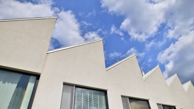 Modern geometric housing architecture. Sunlight  on surface of apartment building, architecture design concept.