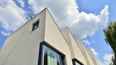 Modern geometric housing architecture. Sunlight  on surface of apartment building, architecture design concept.