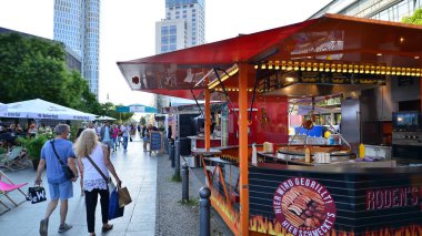 Berlin, Germany. 16 August 2022. People walk on the street market on near the Europa Center in West Berlin. Many stalls with food nearby. 