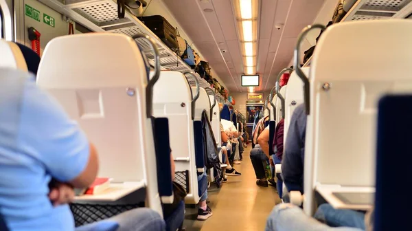 Traveling people by comfortable train. The interior of a luxury train with passengers