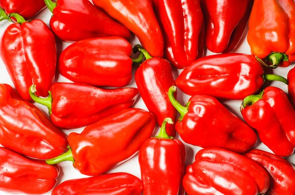 Red sweet peppers background — Stock Photo, Image