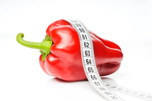 Red pepper in measure tape — Stock Photo, Image