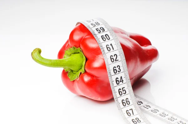 Red pepper in measure tape — Stock Photo, Image