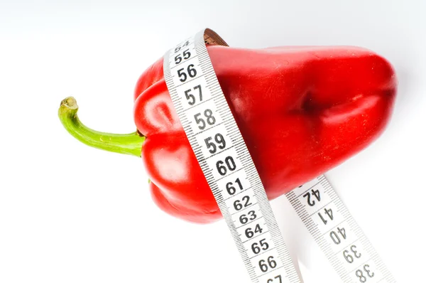 Red pepper in measure tape — Stock Photo, Image