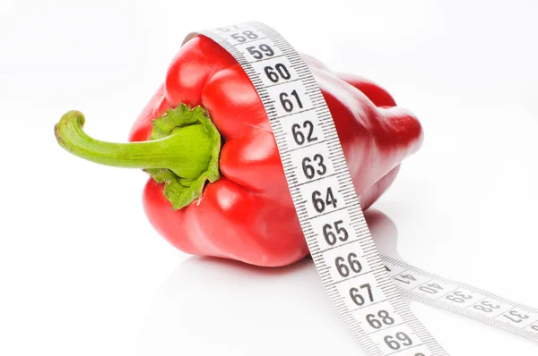 Red pepper in measure tape — Stock Photo, Image