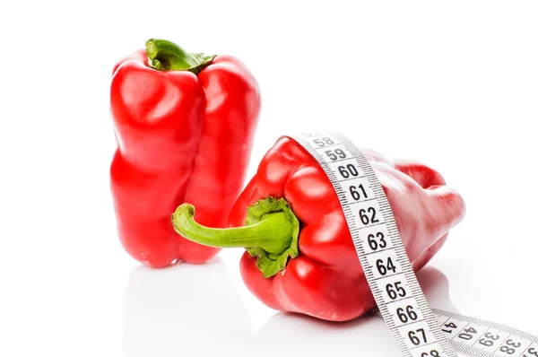 Red peppers in measure tape — Stock Photo, Image