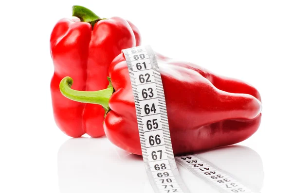 Red peppers in measure tape — Stock Photo, Image