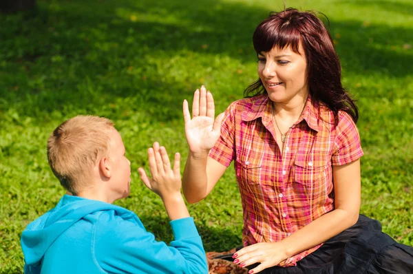 Mother and son outdoors — Stock Photo, Image