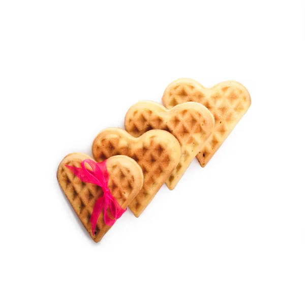 Heart shaped waffles with pink ribbon — Stock Photo, Image