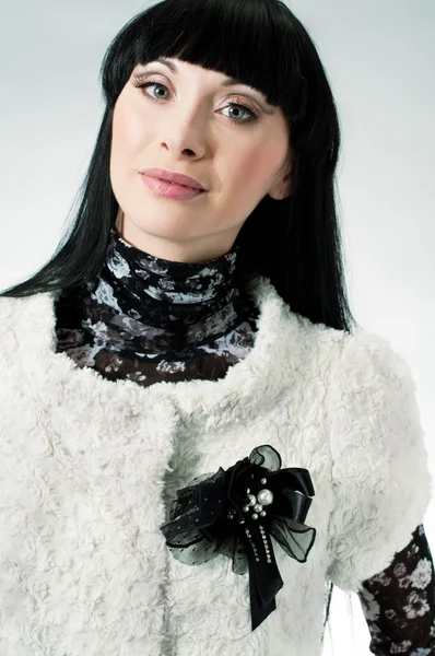 Girl with black brooch — Stock Photo, Image